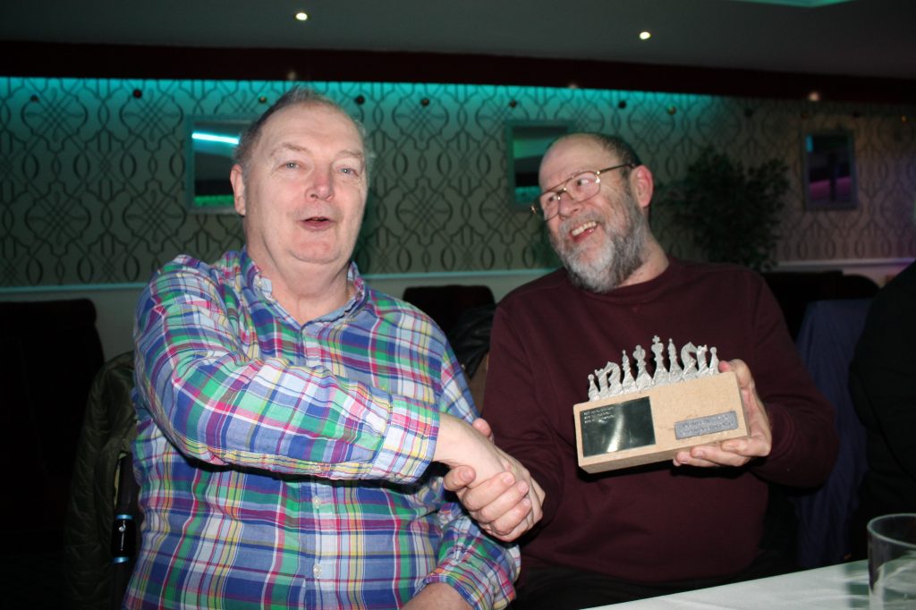 Steve Dunleavy (left) presents the Knockout Trophy to Peter Przybycin