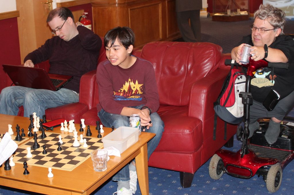 Joseph Henbury (centre) and Michael Henbury (right) analysing a chess game at Dudley 2013