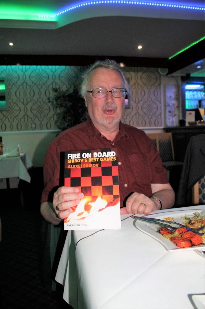 Keith Gregory with his Book Prize at the Curry social night 26 May 2022