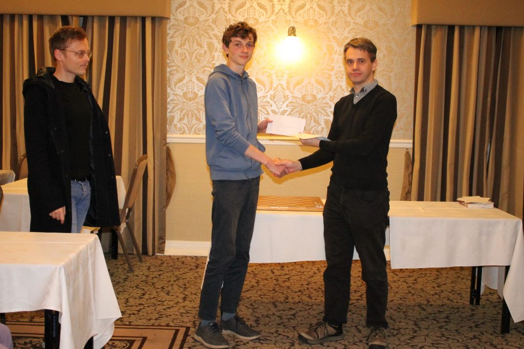 Iwan Cave is presented with 2nd place Prize in the Open