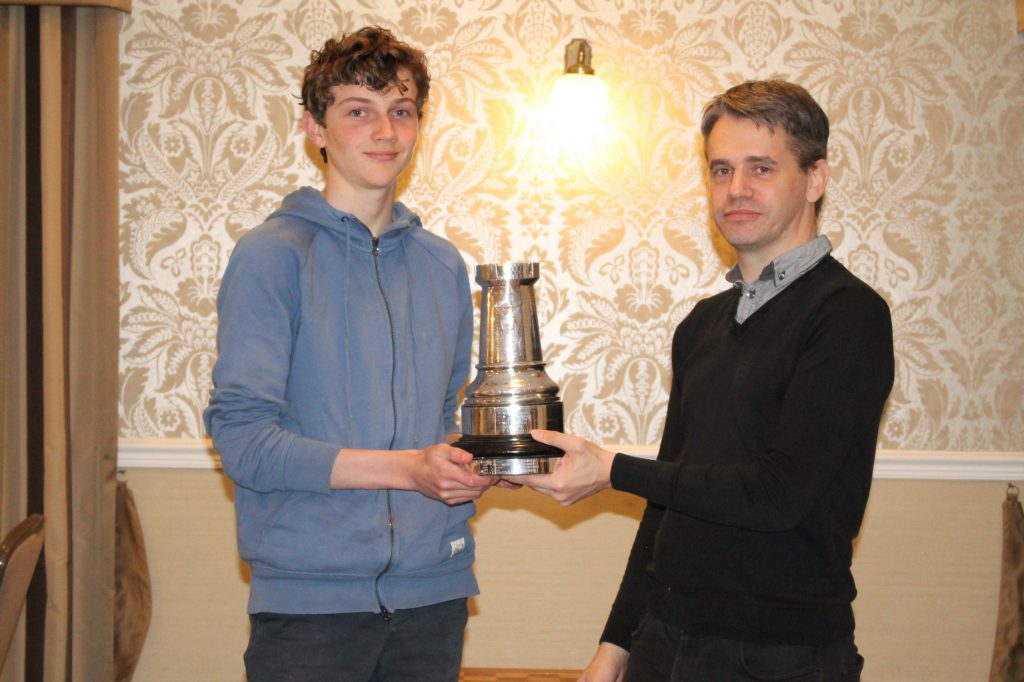 Iwan Cave is presented with Hampshire Champion Prize, the Silver Rook