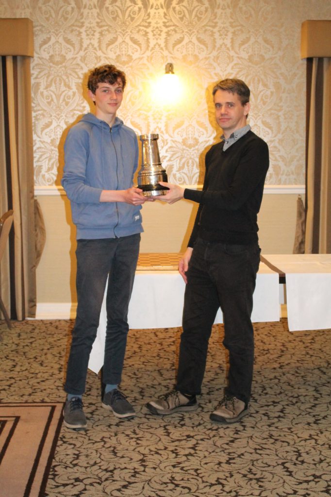 Iwan Cave is presented with Hampshire Champion Prize, the Silver Rook