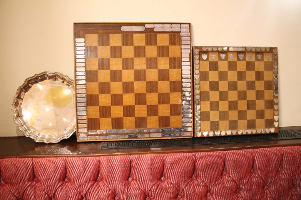 A great haul of trophies for Chandlers Ford in the 2023-24 season: the Robertson Plate, the Division 2 Trophy, and the Division 3 Trophy